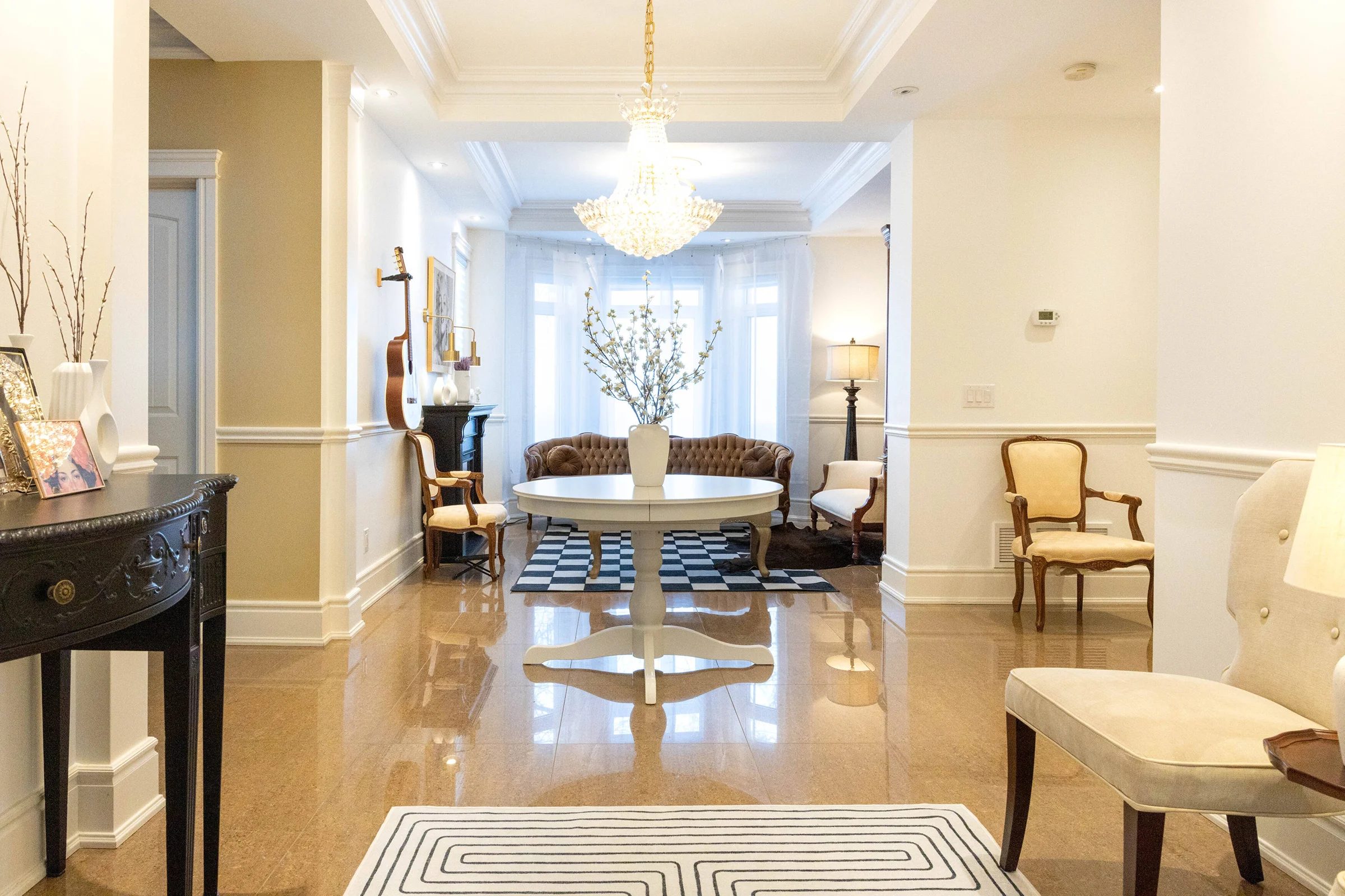 A living room filled with furniture and a chandelier