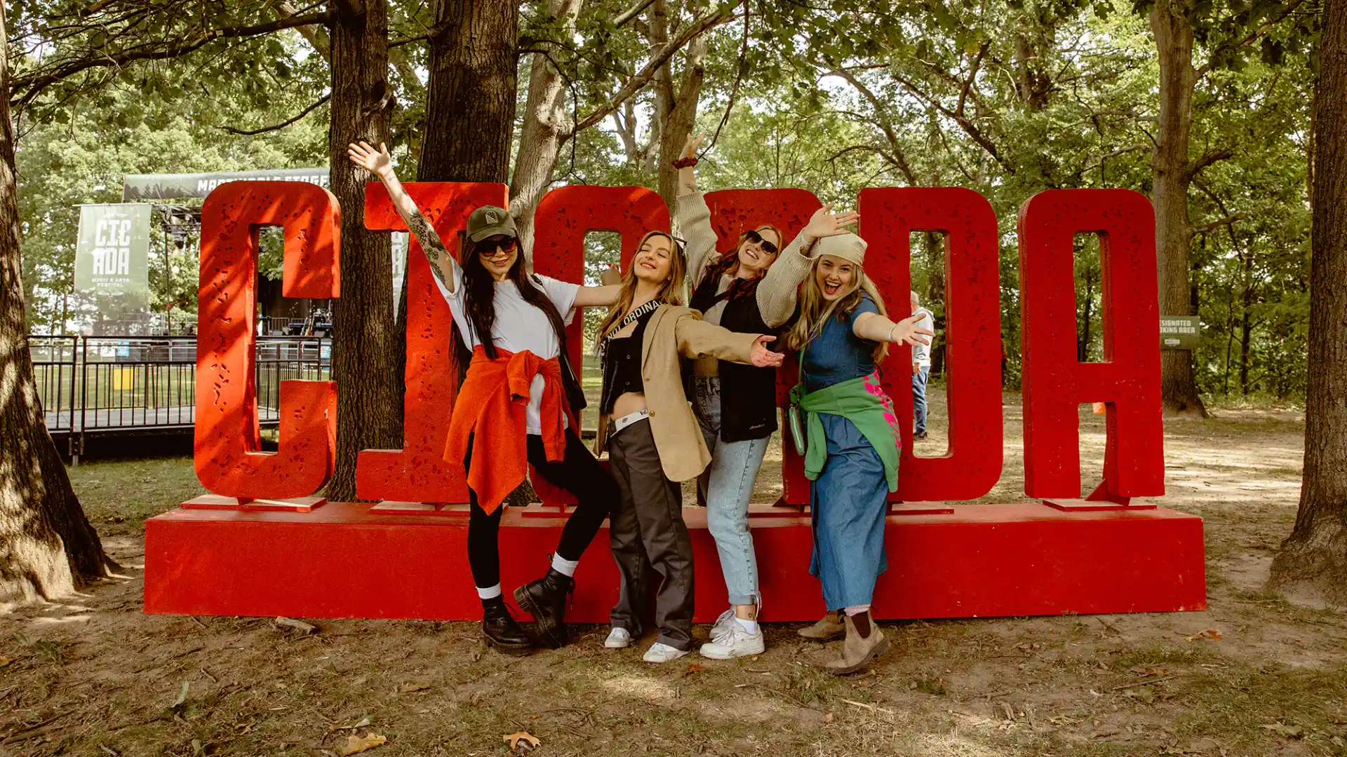 A group of people standing in front of a sign